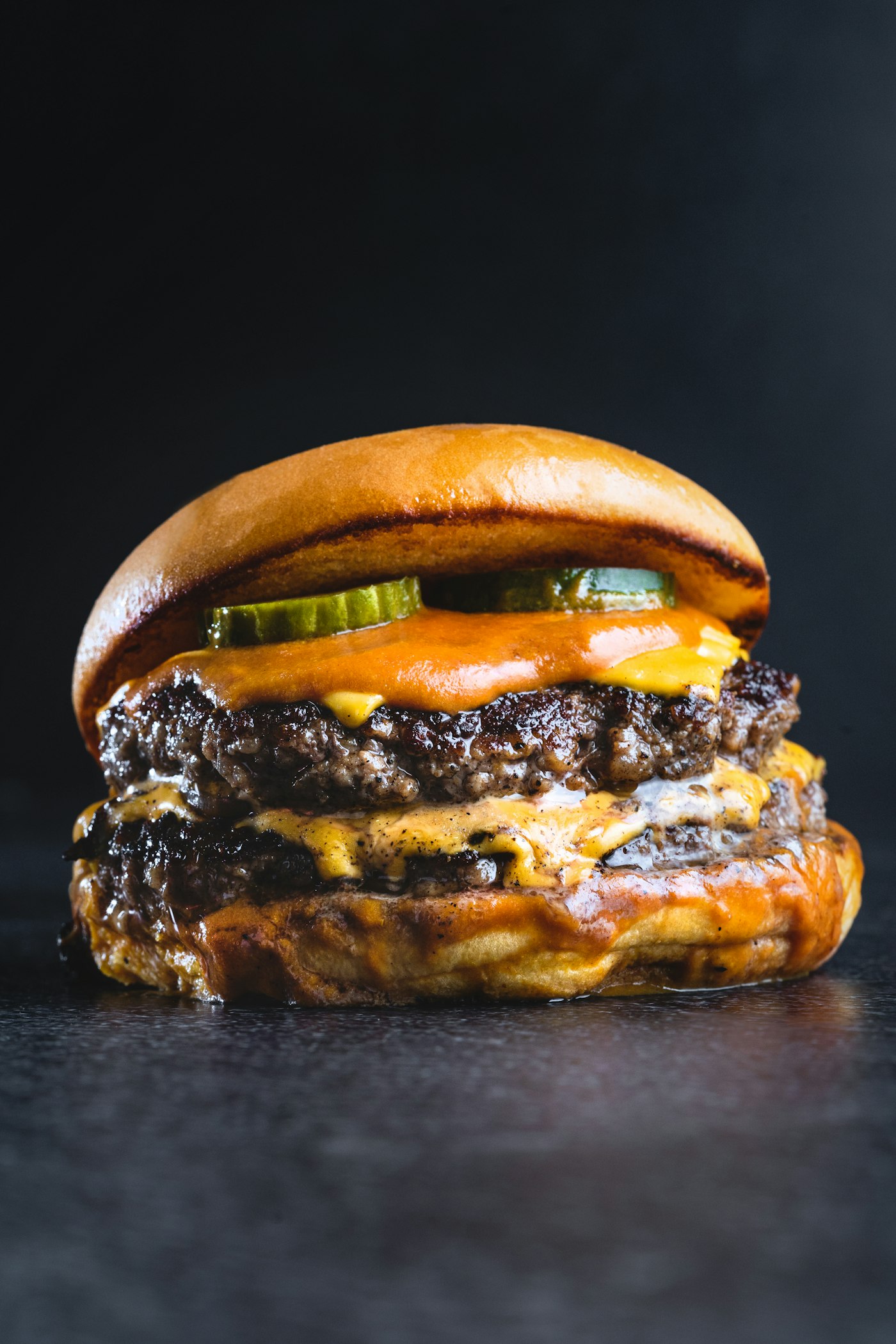 Smash burger with melted cheese and pickles