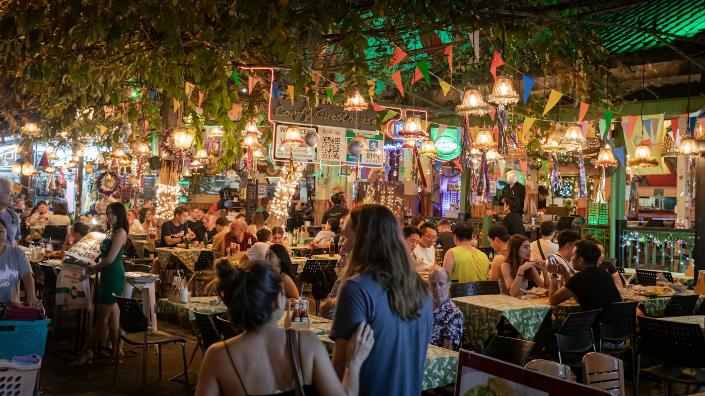 Busy outdoor food hall at night