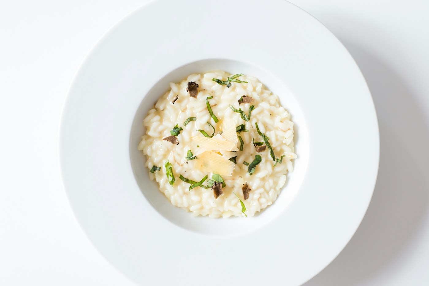 Wild mushroom risotto on a white plate