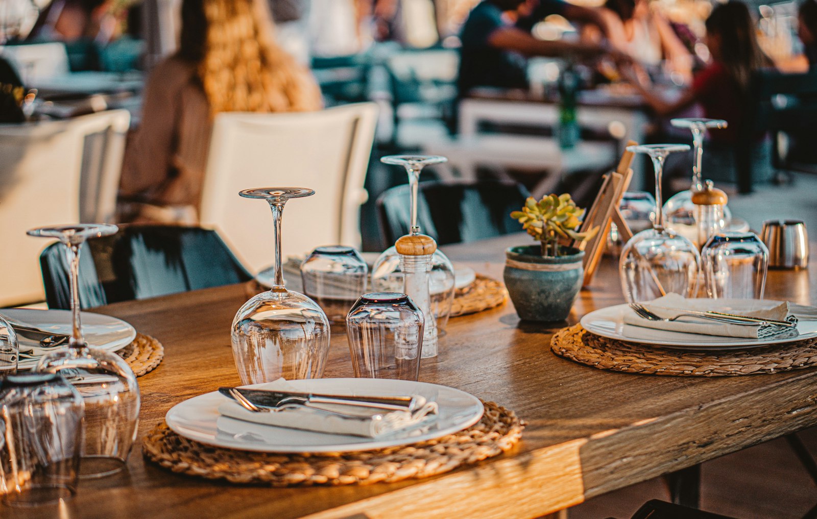 A table set with glassware and linen
