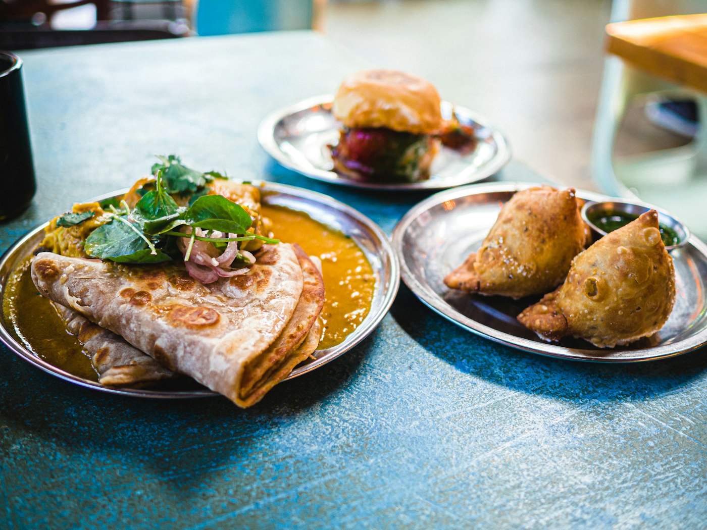 Dosas and sambar lined up at the pass