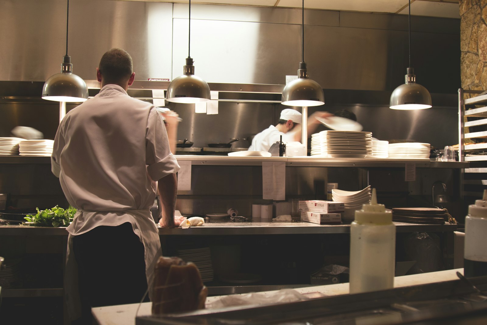 The open kitchen, stainless steel and quiet focus